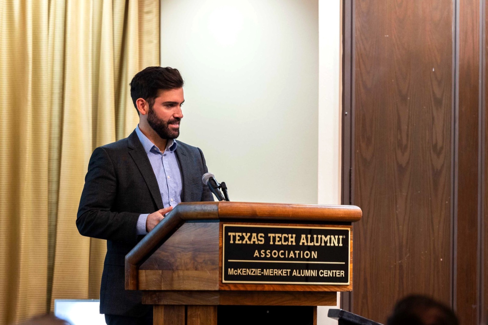 Jacob Kirksey speaking at a podium